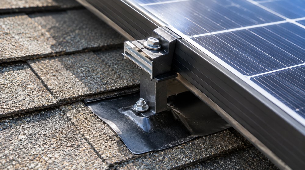 Close-up of a solar panel mounting bracket attached to a Florida roof
